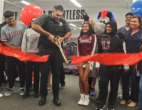Principal Garcia Cuts Ribbons Western Weight Room
